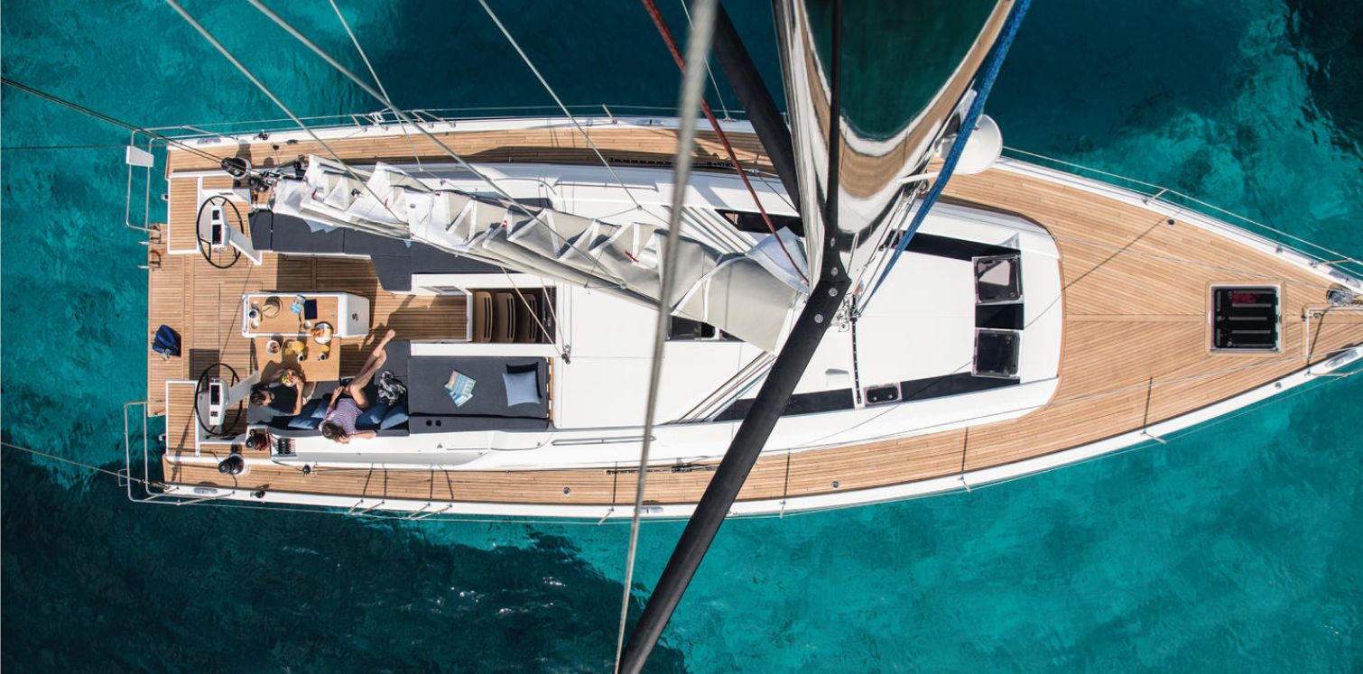 Deck of Beneteau yacht with seating area and helm